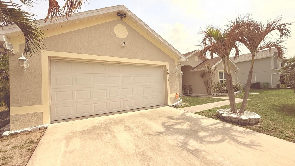 Photo of 1613 SW Whipple Avenue, Port Saint Lucie, FL 34953 (MLS # B26043550)