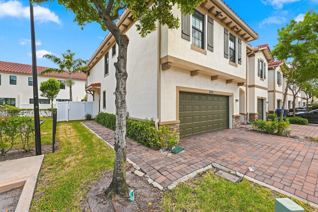 Photo of 2011 Tamarind Drive, Riviera Beach, FL 33410 (MLS # B26068678)
