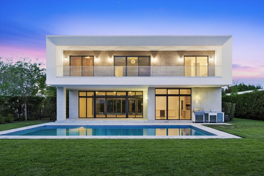 Spectacular lakefront residence in the exclusive Botaniko community in Weston—a private enclave of modern homes designed by renowned architects. This exceptional property features 5 bedrooms plus a dedicated office and 6.5 bathrooms. Interior highlights include porcelain tile flooring in the main living areas and hardwood floors throughout the bedrooms and staircase. The home offers an open-concept layout with a sleek Italian kitchen equipped with top-of-the-line appliances. Outdoor living is elevated with an oversized pool, expansive covered patio, and fully equipped summer kitchen—ideal for entertaining. Additional features include a wraparound balcony, oversized driveway, and a 3-car garage.