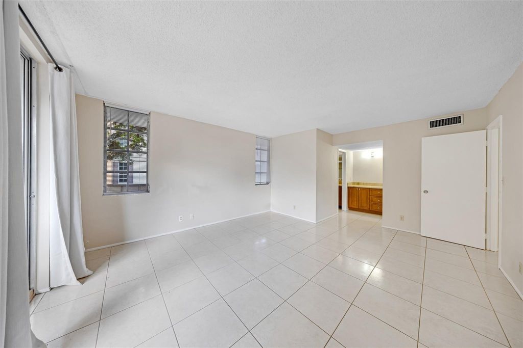 Photo of 2601 S Palm Aire Dr #212, Pompano Beach, FL 33069 (MLS # F10532898)