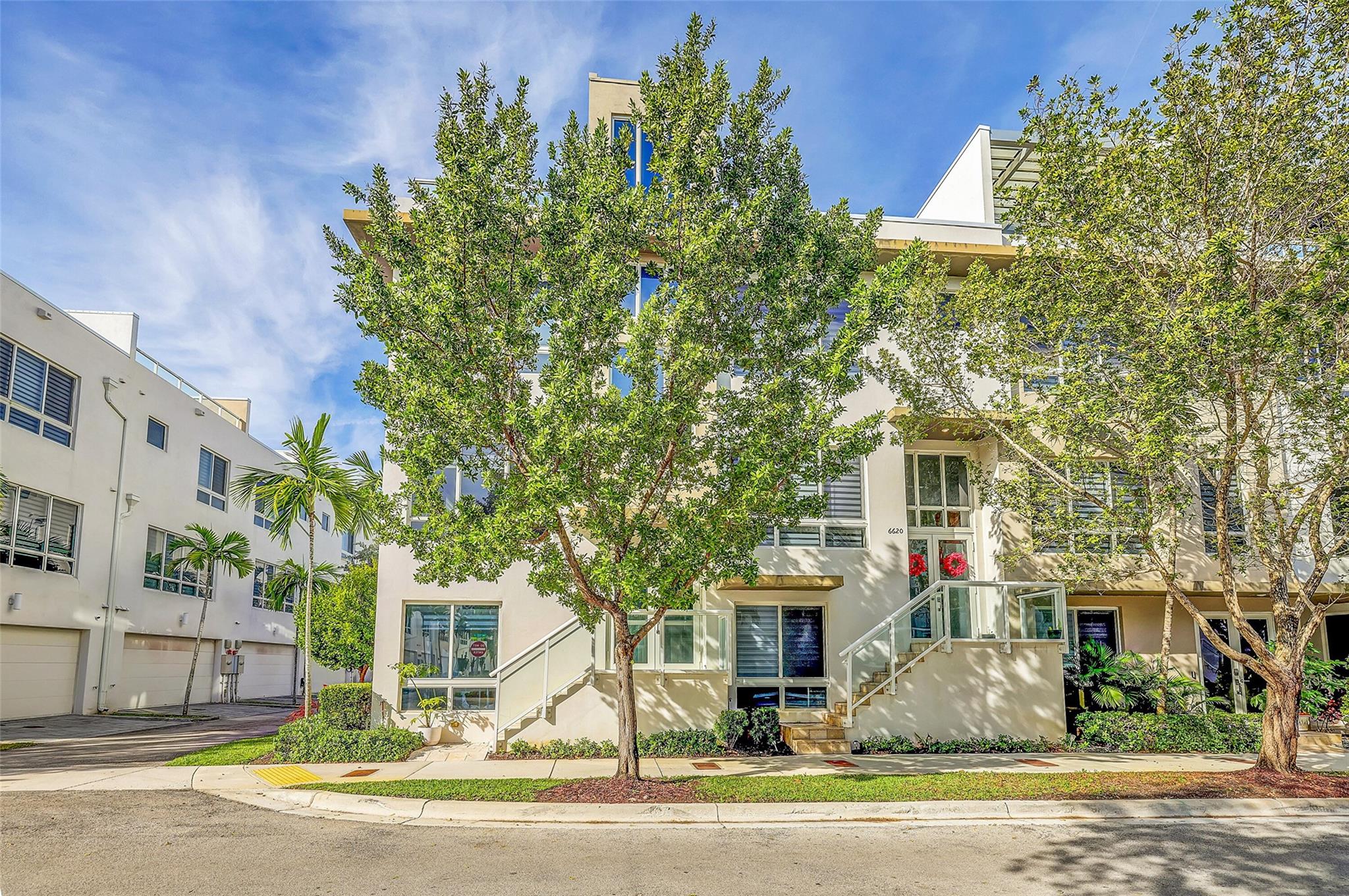 Modern 4 Story, Corner Townhouse with Elevator Accessing All 4 Floors...Resort Style Living with Clubhouse, Fitness Center, Sauna, Pool, Jacuzzi Hot Tub, Splash Park For Kids, Tennis Courts, Cabana....Located in the Heart of Doral near Schools, Shopping, Restaurants...Roof Top Covered Terrace with Summer Kitchen / Roof Top Furniture and Decor Included IN Purchase.... Elevator and Home Warranties Transferable...Wired with Fiber Optic with At&T...Ring Doorbell and Outdoor Motion Cameras....Custom 2 Car Garage with Shelving System and LED Lighting...Custom Closets with Builtins....Custom Pantry and Cabinets in Kitchen...3M Window Tinting... Upgraded Front Loading Low Profile Washer and Dryer....Bottom Floor Could Be Used As Mother In Law / Nanny Suite or Possible Rental...Recently Painted Ext