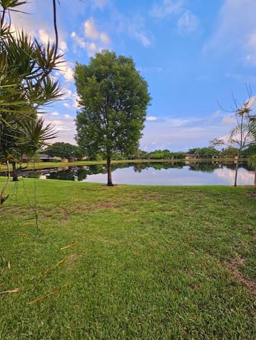 Welcome to the Best Hidden Gem in Plantation! This bright and beautiful 3-bedroom, 2-bath home offers incredible lake views and a truly move-in ready experience. Featuring NO popcorn ceilings and soaring vaulted ceilings, this home has been thoughtfully updated for modern comfort and style. Enjoy peace of mind with a new roof (2022), a 2-year-old AC, and accordion hurricane shutters throughout. The kitchen and bathrooms were fully renovated just 3 years ago, along with the washer, dryer, and kitchen appliances. Located in a quiet, well-maintained community with low HOA fees, this home is within walking distance to Plantation Walk and just minutes from Sawgrass Mills Mall, shops, restaurants, and Fort Lauderdale-Hollywood International Airport. Showings from 2-6