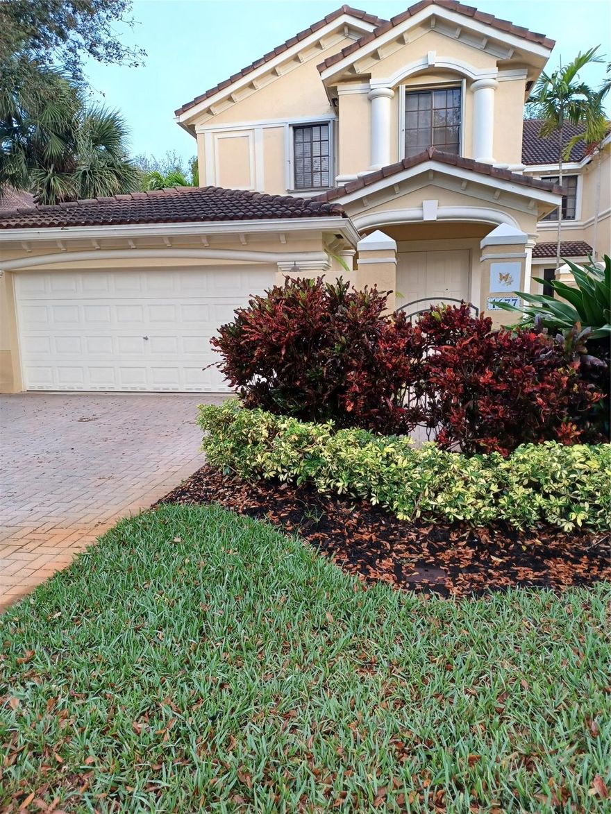 Immaculate Coach Home in the heart of Weston just steps from Weston Town Center where you will find shops, restaurants, entertainment, banking, Publix, and more.  Gated community.  Viceroy Model, the largest floor plan with storage/elevator connectivity.  Split floor plan with 4 bedrooms, 2.5 baths, 2360 square feet, 2 car garage, and large paver driveway for 2 cars. Very bright and spacious, neutral colors, island kitchen with wood cabinets, granite countertops, limestone backsplash, new stainless-steel appliances, breakfast area, and commercial size washer/dryer.  Plenty of space for storage. Accordion hurricane shutters which close form the inside. HOA fully maintains the exterior, including Roof, Landscaping, Insurance, Painting & Security.