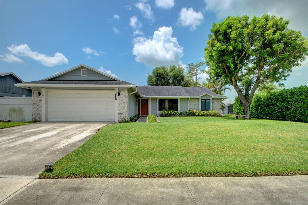 Photo of 119 Parkwood Drive, Royal Palm Beach, FL 33411 (MLS # R10905731)