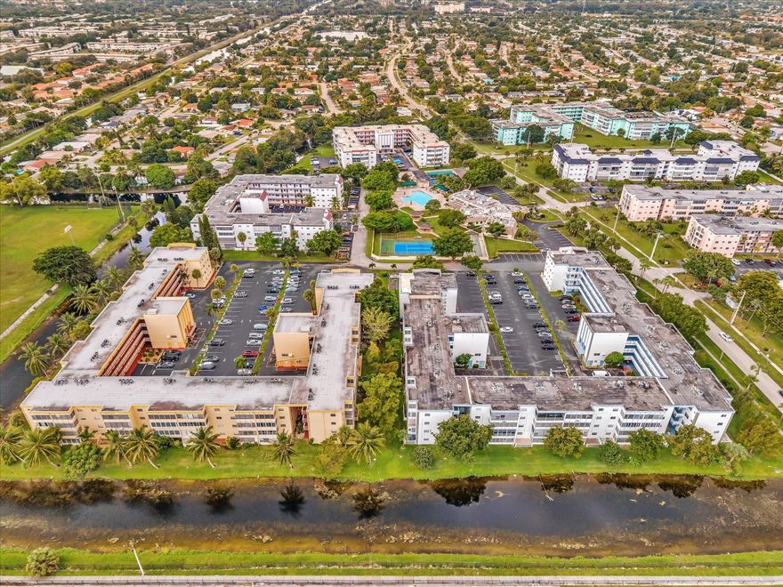 Live your best Florida days in this breezy 1-bed/1.5-bath end unit, in a vibrant 55+ community! Striking 24” × 24” marble tile floors/stylish designer touches throughout. New roof and newly painted bldg: brand new A/C, tankless heater. The kitchen is a standout & and has granite countertops/stainless steel appliances. Open living space draws your eye to the wide/airy vista ahead. The Large En suite has a walk-in closet. Shared outdoor spaces offer tennis/pickleball courts, shuffleboard & bocce, a full indoor gym, billiards, a library, bingo nights, a huge sparkling pool, & barbecue area. Whether you're hitting a match, chilling by the pool, or firing up the grill with friends, this place is all about living well & living easily. Move in and start having some fun in the sun, all year long!