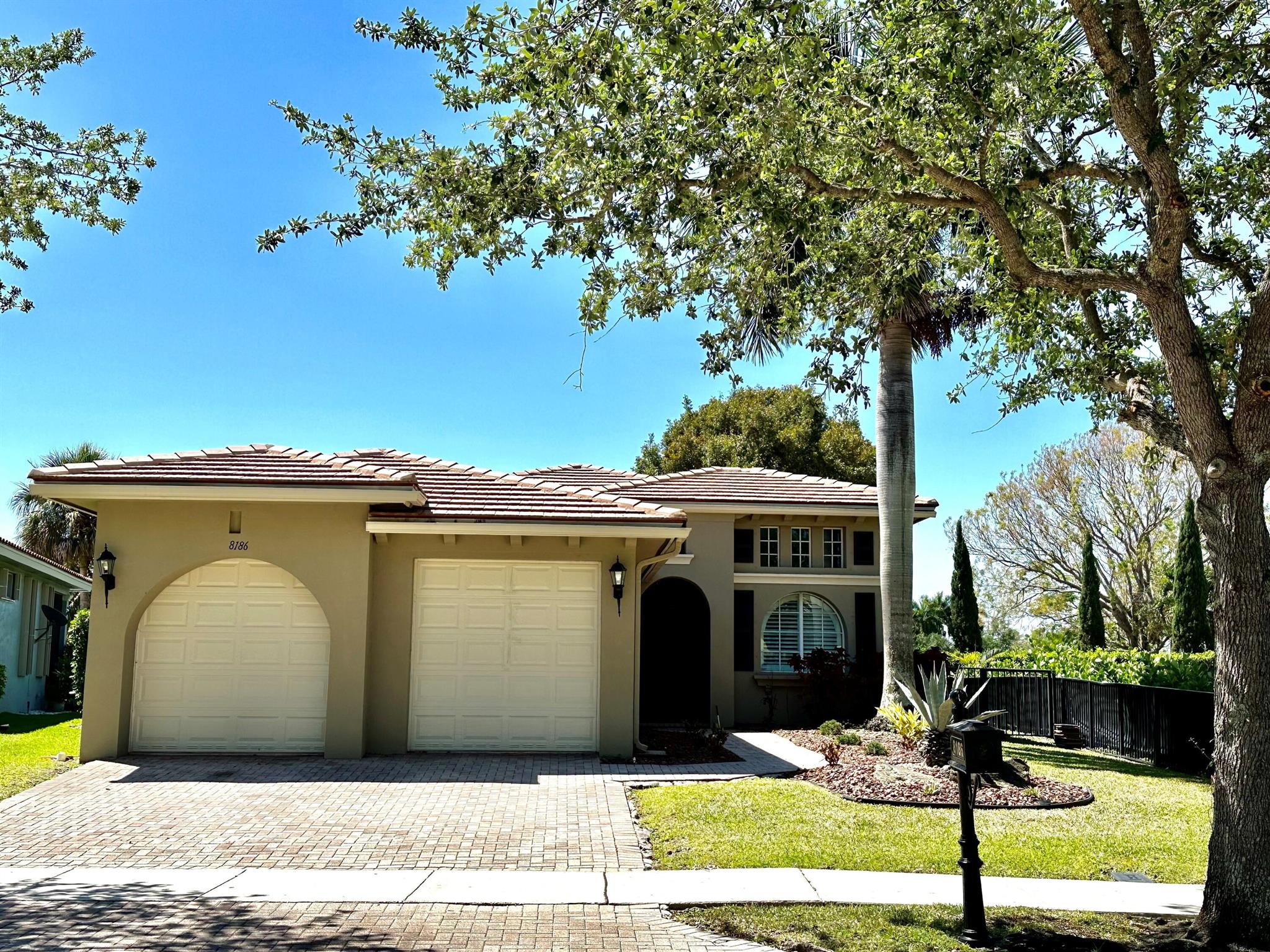 Live the Heron Bay Lifestyle Here in This Warm and Inviting 3 Beds 2 Baths Home w/ Endless Lake Views! Features Include a Fully Fenced Backyard w/ Plenty of Room For a Pool, Wood Flooring Throughout Main Living Areas, Beautiful Kitchen w/ White Cabinets, Granite Countertops, and Tumbled Marble Backsplash, California Closet in Primary and One Bedroom, Jacuzzi Tub, Plantation Shutters, Brand New GE Dryer, Crown Molding, High Ceilings, Tons of Natural Light, Community Includes Resort Style Amenities w/ Two Clubhouses, Fitness Center, Splash Park, Playground, Tennis, Basketball Courts and So Much More, Parkland's A Rated Schools, Make This Home Yours Today!!
