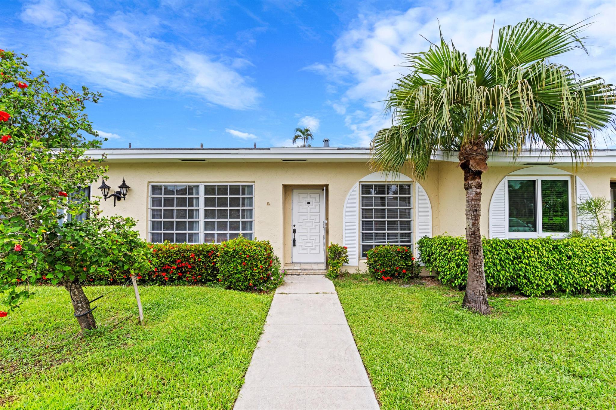 Escape to Florida's best-kept secret! This charming 2-bed, 2-bath villa in Palm Greens of Delray Beach is your ticket to a vibrant 55+ community lifestyle. Priced for a quick sale, this unit is a blank canvas awaiting your personal touch. Enjoy the best of outdoor living on the screened and covered patio with a desirable southern exposure, providing year-round sunlight and tranquil views. No roads behind the unit means ultimate privacy! Features include a spacious master bedroom, assigned parking, and a convenient layout. Don't miss this opportunity to own a slice of paradise in a fantastic location. Act fast!