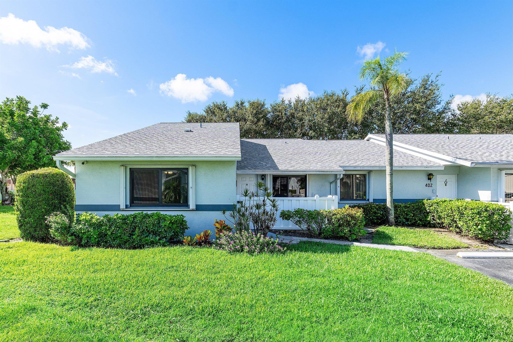 Fully remodeled corner villa in a pet-friendly 55+ community, allowing residents 18 and older. This unit offers privacy, plenty of natural light, and an open floor plan. The 3-bedrooms, 2-baths, feature custom-built ceiling-height kitchen cabinetry with soft-close drawers, quartz countertops, tile backsplash, pantry and newer appliances. Smooth ceilings with new insulation throughout including the Florida Room. Tile flooring throughout and upgraded LED recessed lighting. Split floor plan with walk-in closets in every room. Both bathrooms have been upgraded with modern tilework, vanities, mirrors & finishes. Laundry room with extra storage & tankless water heater. The fenced porch with Marble brick path and a private paved patio- ideal for relaxing. Extra features: Windstorm
