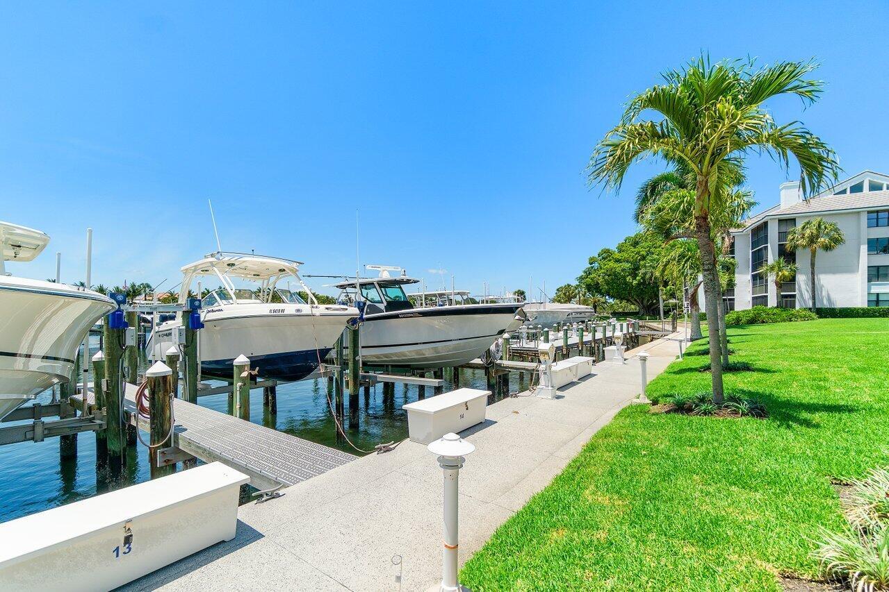 LUXURY MARINA COMMUNITY, FORMER MODEL WITH DESIGNER FURNITURE AND FINISHES. FURNISHED ANNUAL TURN-KEY 3/3 PENTHOUSE CORNER APARTMENT. END UNIT 9' COVERED BALCONY, SOUTHERN EXPOSURE, CHIC WHITE GLASS PORCELAIN FLOORS, PHANTOM SCREENS, BRIGHT & OPEN, GREAT ROOM FEATURES COVE LIGHTING & LUX CHANDELIERS, CHEFS' KITCHEN, BOSCH APPLIANCES, CUSTOM WINE BAR WCOOLER & PANTRY. MASTER SUITE WITH PRIVATE BALCONY GENEROUS CLOSET AND MARBLE BATH WITH SOAKING TUB.RESORT-STYLED COMMUNITY FEATURES INCLUDE LUXURY CLUBHOUSE, MARINA, HEATED POOL & SPA, STATE-OF-THE-ART FITNESS CENTER, TENNIS, BOCCE BALL, WI-FI THROUGHOUT CLUB AREA, 5 ACRES OF LUSHULY LANDSCAPED GARDENS, AND WALKWAYS, MAINTENCE FREE LIVING, 1 MILE TO THE BEACH. 40' DOCK ALSO AVAILABLE FOR ADDITIONAL $900/MO. EASY TO SEE