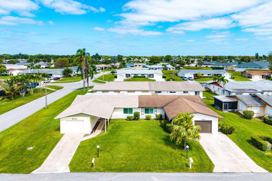 Welcome to 6061 Stanley Ln in Delray Beach, FL a beautifully designed 1,475 sq. ft. corner-lot villa that offers unparalleled comfort and style. This 2-bedroom, 2-bathroom home boasts a total of 7 spacious rooms, perfect for relaxing and entertaining. Property has a new 2026 roof, new 2024 a/c unit, 2024 hot water heater and 2021 Hurricane impact windows. Step inside to discover a seamless combination of ceramic and Engineer hardwood floors throughout, including additional hurricane shutters for added peace of mind. The large kitchen featuring stainless steel appliances, an electric stove, range hood, dishwasher, refrigerator, pantry, and a windowed eat-in breakfast nook. The primary suite offers a serene sanctuary with a walk-in closet, and large bathroom.   Additional highlights include a formal dining room, ample storage, and in-unit laundry with a washer and dryer.  Outdoor living is elevated with your private patio, perfect for enjoying the southeastern exposure and Florida sunshine. Residents also have access to fantastic community amenities, such as a sparkling communal pool, vibrant clubhouse, game room, gym, communal tennis court, bocce ball court, and serene gazebo spaces.  Don't miss this opportunity to enjoy resort-style living in a move-in-ready villa with convenient features, and an ideal corner-lot location. Schedule your private showing today!