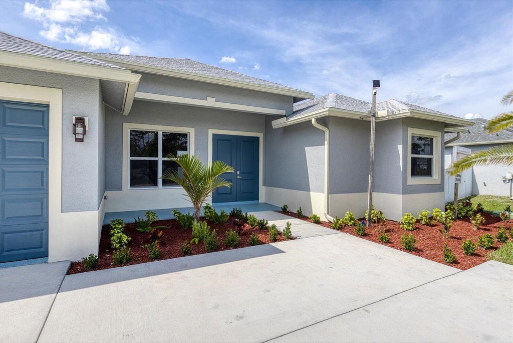 Photo of 1722 SW California Boulevard, Port Saint Lucie, FL 34953 (MLS # R11064587)