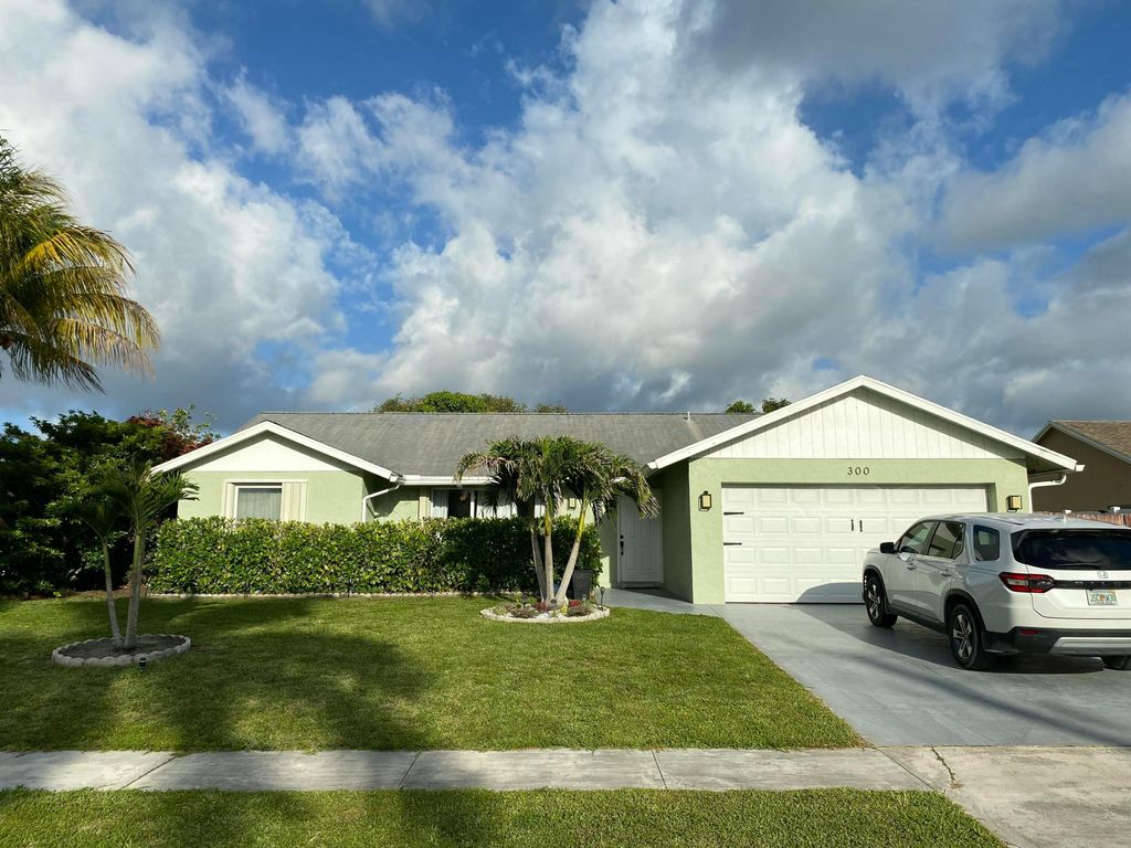 Photo of 300 La Mancha Avenue, Royal Palm Beach, FL 33411 (MLS # B26032439)