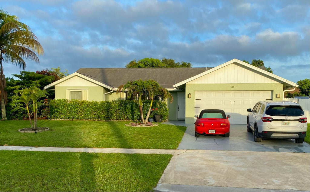 Photo of 300 La Mancha Avenue, Royal Palm Beach, FL 33411 (MLS # B26032439)