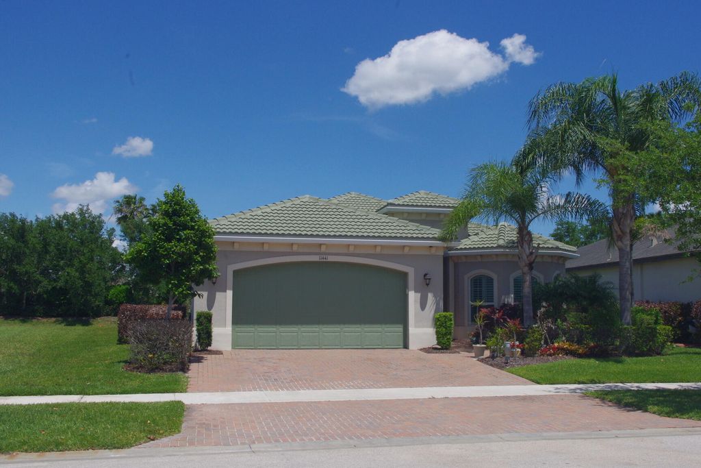 Photo of 11441 SW Lake Park Drive, Port Saint Lucie, FL 34987 (MLS # B26018097)