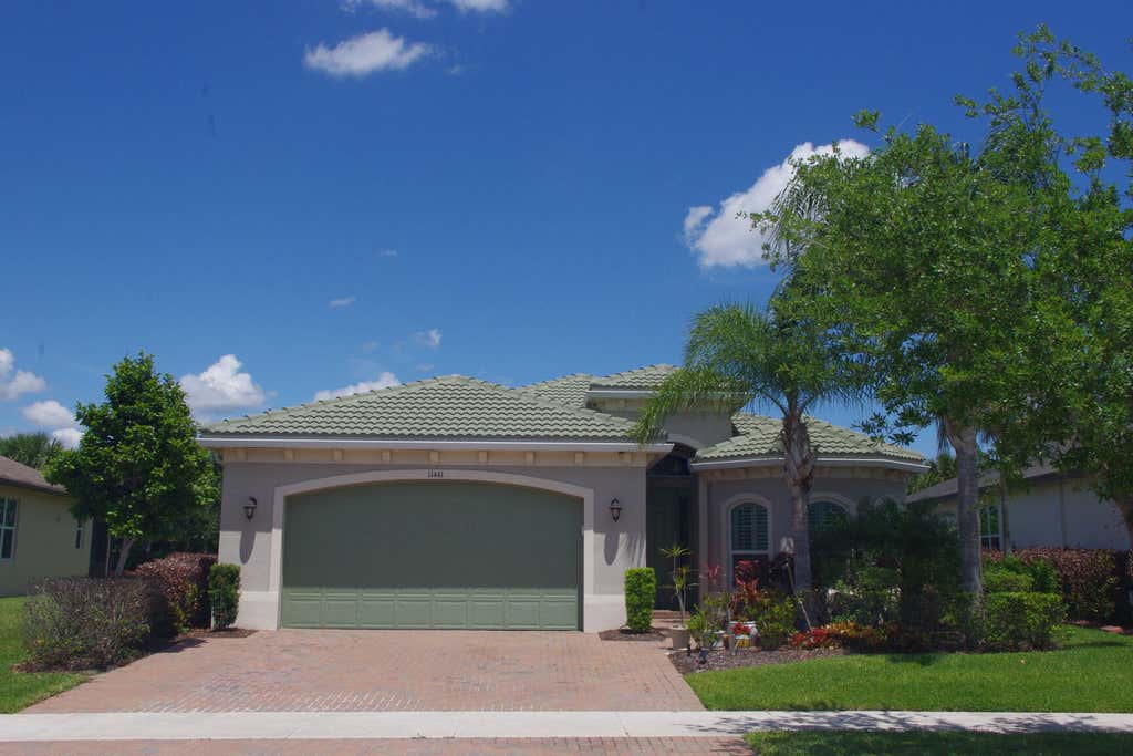 Photo of 11441 SW Lake Park Drive, Port Saint Lucie, FL 34987 (MLS # B26018097)
