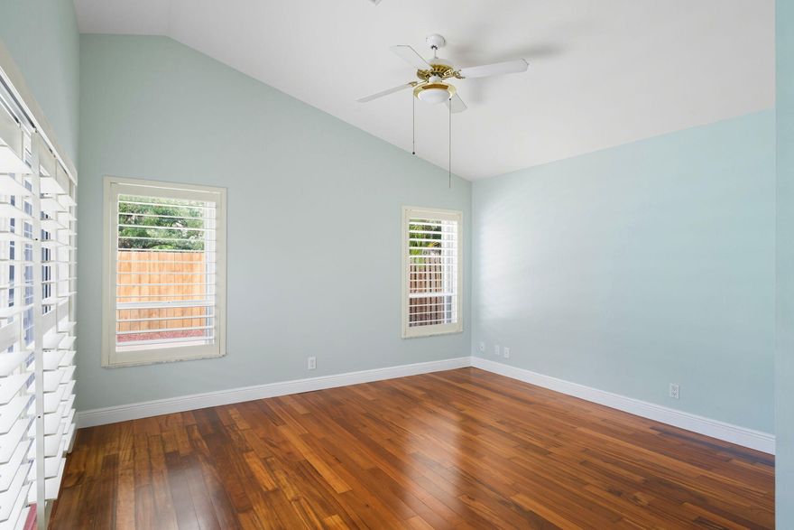 Welcome to this inviting 3-bed, 2-bath single-story home offering 1,368 sq ft of comfortable living—perfect as your primary home or a vacation getaway. With no HOA, enjoy the flexibility and freedom you deserve. Inside, warm wood floors flow throughout, complemented by an upgraded impact front door and hurricane shutters for added security. The bright, open layout includes a spacious living and dining area and a beautifully updated kitchen with new appliances. Step out back to your fenced private oasis featuring a large travertine patio—perfect for gatherings or quiet evenings. Solar panels boost energy efficiency, and the attached 1car garage adds everyday convenience. Located just minutes from shopping, dining, and major routes, this home truly has it all.
