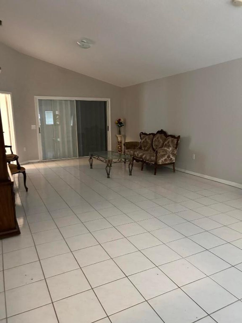 Photo of 1159 NW Lombardy Drive, Port Saint Lucie, FL 34986 (MLS # R11158634)