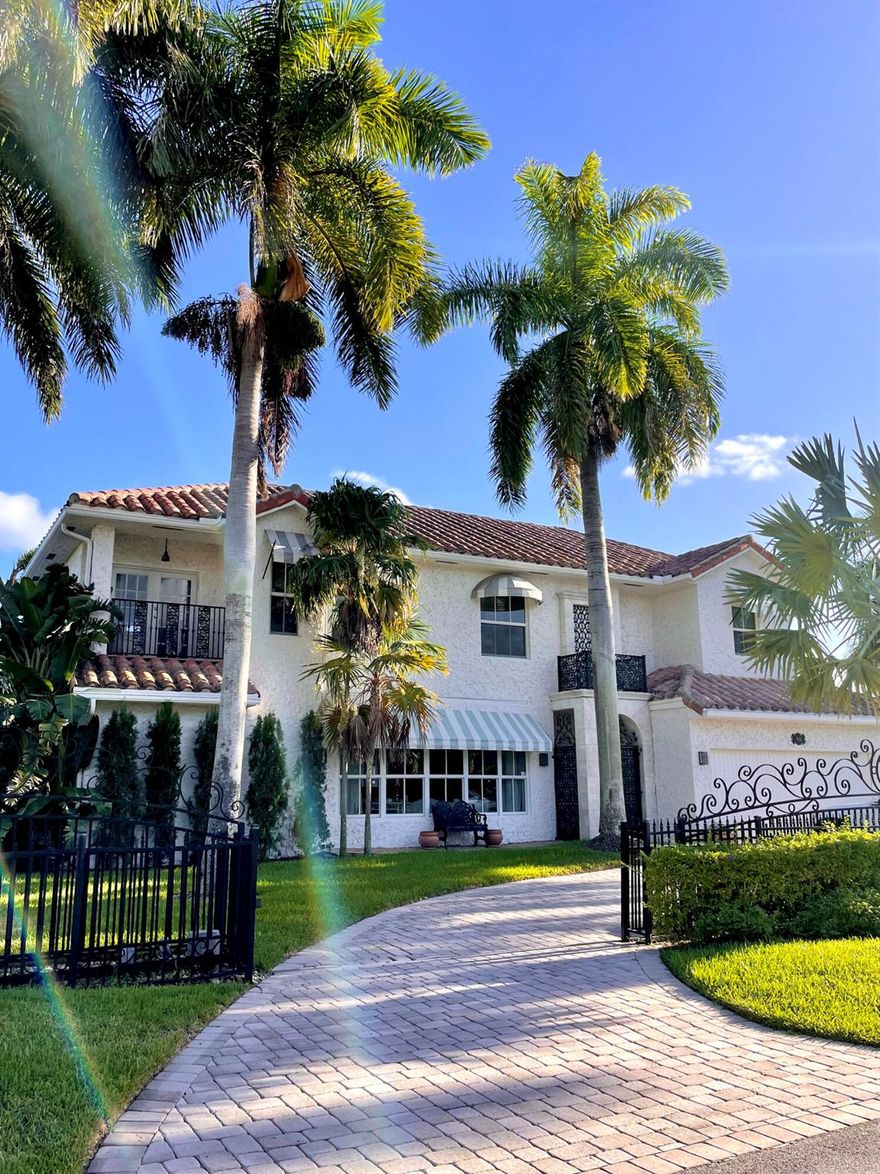 Seasonal or Annual, luxury waterfront living. A short walk to the beautiful Atlantic ocean, or take a quick drive to the vibrant and popular Atlantic Avenue and downtown Delray Beach. A stunning deep-water, pool home offering a 90' dock in the highly desirable Tropic Isle neighborhood. Meticulously maintained with an open and airy floor plan, providing canal and sparkling pool views from every room. Featuring a sumptuous master suite and bathroom, plus an additional three bedrooms, all en-suite. Each bedroom also provides outdoor access via private wrap around balconies maximizing water views. The home additionally features a large, private office/tv/game room, and a spacious two-car garage. A quick boat ride along the intracoastal waterway leads to