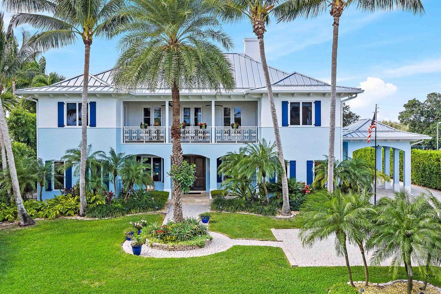 Experience year round ocean breezes in this British West Indies inspired 4 BR, 4.5 BA home perfectly positioned 24 feet above sea level across from the Intracoastal Waterway and set on a 3/4 acre lot. A major renovation completed in 2022 introduced porcelain tile flooring, high-end cabinetry, quartz countertops, Thermador appliances, and a newly built resort style pool.  Entertain effortlessly in the gourmet kitchen, dining area with the convenience of a butler's pantry, and spacious living room, or unwind in the media room and secluded guest suite overlooking the pool and lush backyard.Upstairs, the primary suite is a serene retreat with east and west facing balconies and two walk in closets. The 2nd floor also includes a private office and two additional en suite bedrooms.