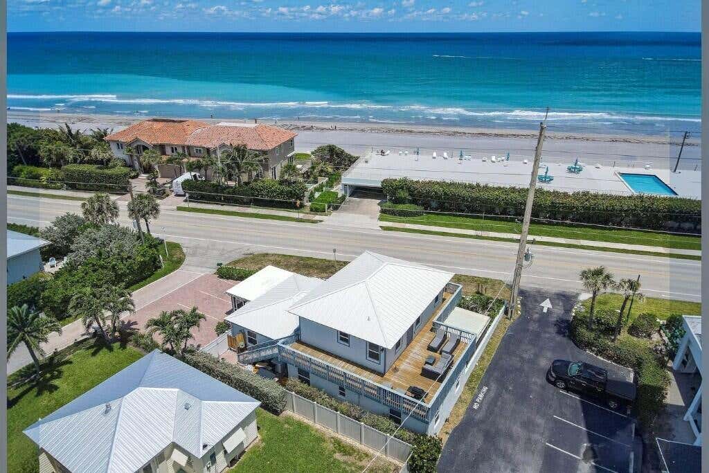 Photo of 941 Ocean Drive, Juno Beach, FL 33408 (MLS # B26060022)