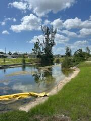 Waterfront lot in the rapidly growing NW Cape Coral corridor! This prime .23 acre lot offers serene canal vistas and direct waterfront access ideal for privacy and relaxation. Located on an interior canal with ~80 ft of waterfrontage, the lot features paved public road access and is zoned R1‑W for single-family residence development Utilities--including public water, municipal sewer, cable, and electrical availability--are in place, streamlining the permitting process for your new construction or seasonal home! With minimal site prep required, this parcel offers an excellent canvas for building a customized Florida retreat.
