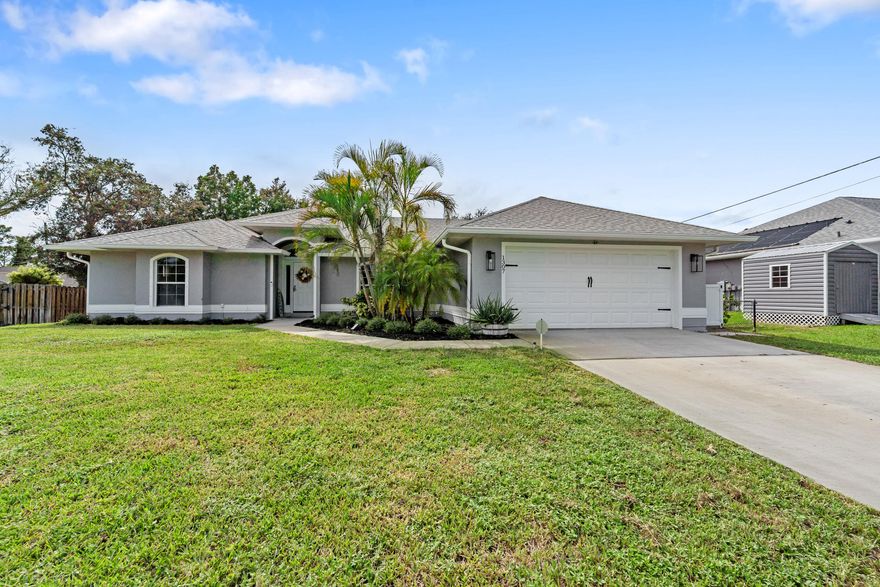 Updated 4 bedroom, 2 bathroom home with over 2,220 sq ft of living space plus a 400 sq ft Florida room in the heart of Sebastian Highlands. Open split floor plan features vaulted ceilings, new luxury vinyl plank flooring throughout, fresh interior and exterior paint, and all new light fixtures. Kitchen has been reconfigured with modern pendant lighting, Samsung stainless steel appliances, and a more open layout for easy flow. Major upgrades include new A/C (2023), brand new ductwork, new water heater (2024), and smart irrigation system. Bathrooms include new toilets and refinished guest tub. All bedrooms feature TV mounts with in-wall outlets. Large fully fenced backyard with mature oak trees offers shade and privacy. Minutes from shopping, dining, and water access with easy access to