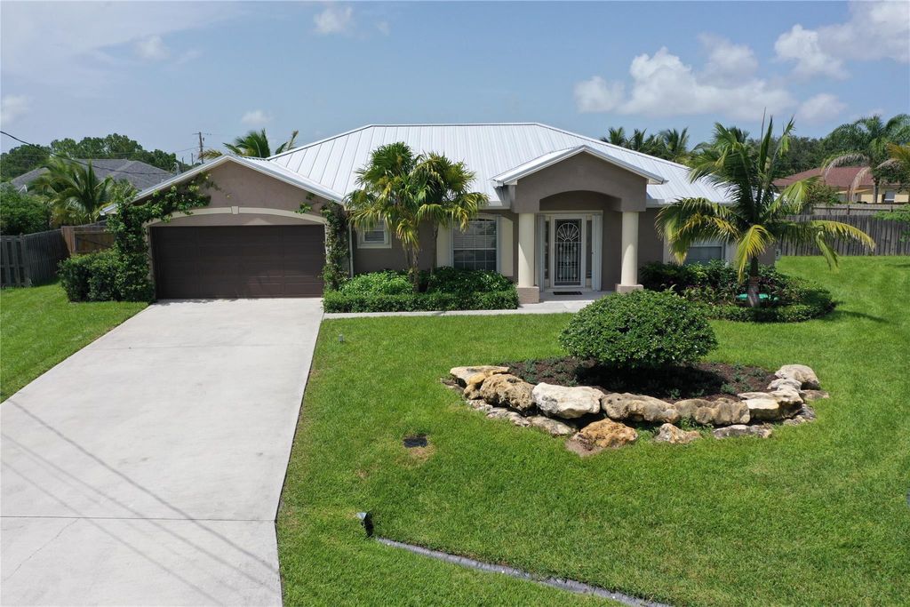Photo of 5645 NW Lorna Court, Port Saint Lucie, FL 34986 (MLS # F10452288)