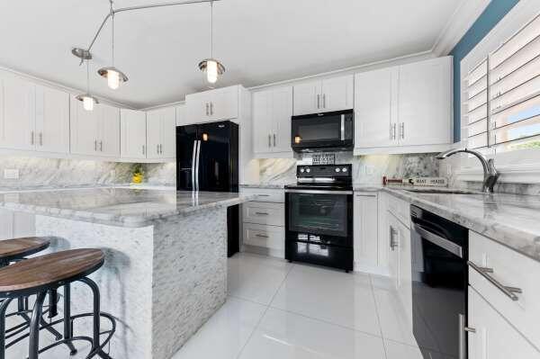 Exquisitely upgraded 2 bedroom first floor corner condo with long view of marina and intracoastal waterway. Kitchen is open to the living area with large island, granite countertops and stainless steel appliances. Gorgeous 30'' white porcelain tile floors throughout the living area. Updated baths. Covered and screened rear patio and large sundeck that has spectacular views over the marina and intracoastal waterway. Seasonal rental. Master bedroom has a queen size bed and the second bedroom has a full size bed. There is a dedicated covered parking space below the unit.Rental break down: $3,800.00 Month plus $200.00 for Utilities a month.