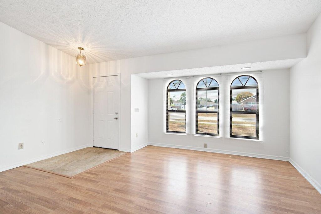 Photo of 1001 SW California Boulevard, Port Saint Lucie, FL 34953 (MLS # R10983349)