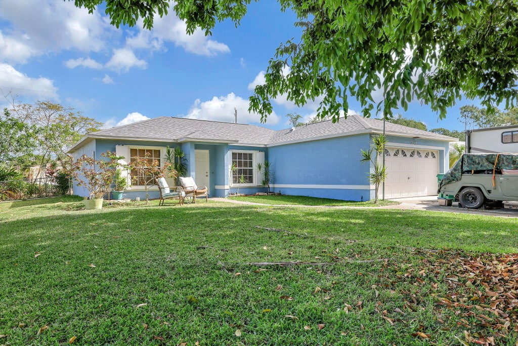 Photo of 2249 SW Kenwick Avenue, Port Saint Lucie, FL 34953 (MLS # R10982085)