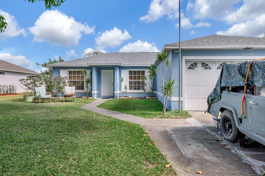 Photo of 2249 SW Kenwick Avenue, Port Saint Lucie, FL 34953 (MLS # R10982085)