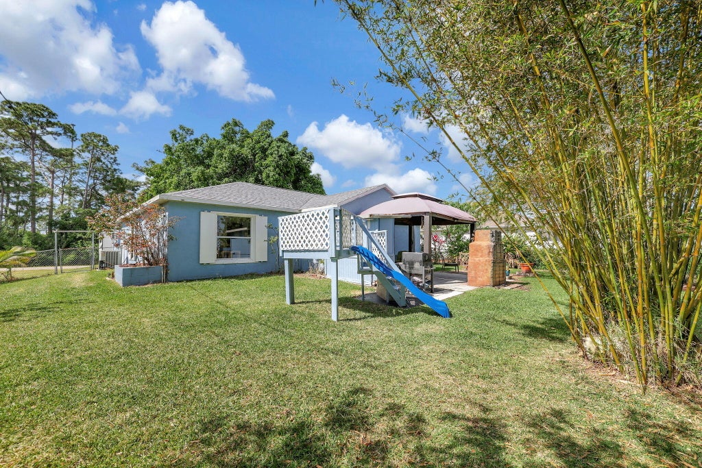 Photo of 2249 SW Kenwick Avenue, Port Saint Lucie, FL 34953 (MLS # R10982085)