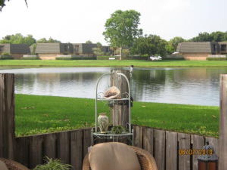 LAKE FRONT - BEST VIEW.  GREAT LOCATION, PARKING RIGHT OUTSIDE UNIT.   Balconies off both bedrooms overlooking the water.  Tile on bottom floor and carpet upstairs.  Great patio for entertaining, fence has drop  down areas to enjoy lake.  All sizes approx. Conveniently located near I95 and turn pike, plus close to shopping, restaurants and city place. only 8 miles to the beach.