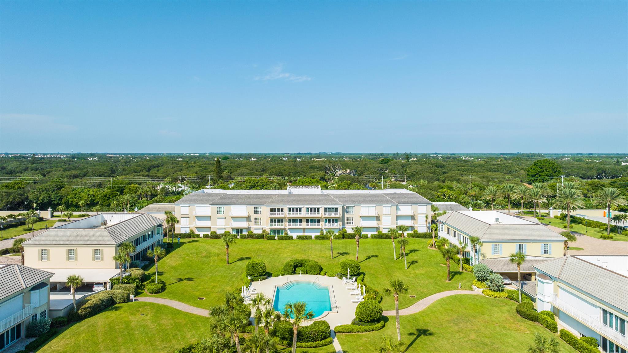Beautiful 2 bedroom, 2 bath penthouse with sweeping ocean views. Delightful east facing balcony. Top quality finishes - wood floors, custom seagrass rugs, bar area, custom cabinetry, marble baths, open kitchen with stainless appliances and honed granite tops. Offered turn key. Sparkling beachfront pool. Two covered parking spaces, one pet allowed (no weight limit). Gated oceanfront community convenient to the island's charming central village. Separate John's Island Club membership affords golf, beach, other club amenities (subject to availability & club policy). Dimensions approximate.