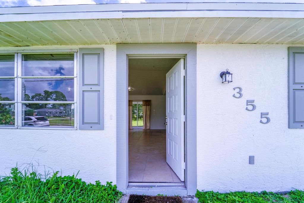 Photo of 355 NW Marion Avenue, Port Saint Lucie, FL 34983 (MLS # R11103345)