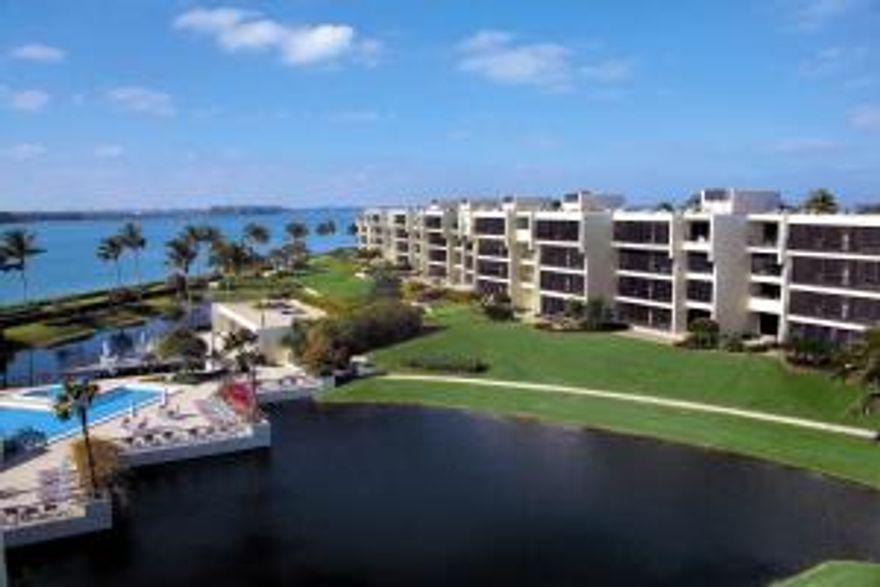 Only walls of glass separate the view of the Atlantic Ocean, the St. Lucie Inlet and the shore line of the Jupiter Island Wildlife Sanctuary from the, newly renovated interior of this spacious condominium.  Engineered hardwood floors, all new stainless kitchen appliances and granite countertops, updated bathrooms and light fixtures are some of the transformations that were completed in 2014.  Delight in the southeast exposure from the screen-enclosed balcony, eat-in kitchen, master bedroom, and living room.  Enjoy a pick-me-up from the wet bar with beverage cooler while relaxing in front of the custom built-in media cabinet in the living room.  This residence offers all the comforts of a private beach home with the convenience of condominium living.