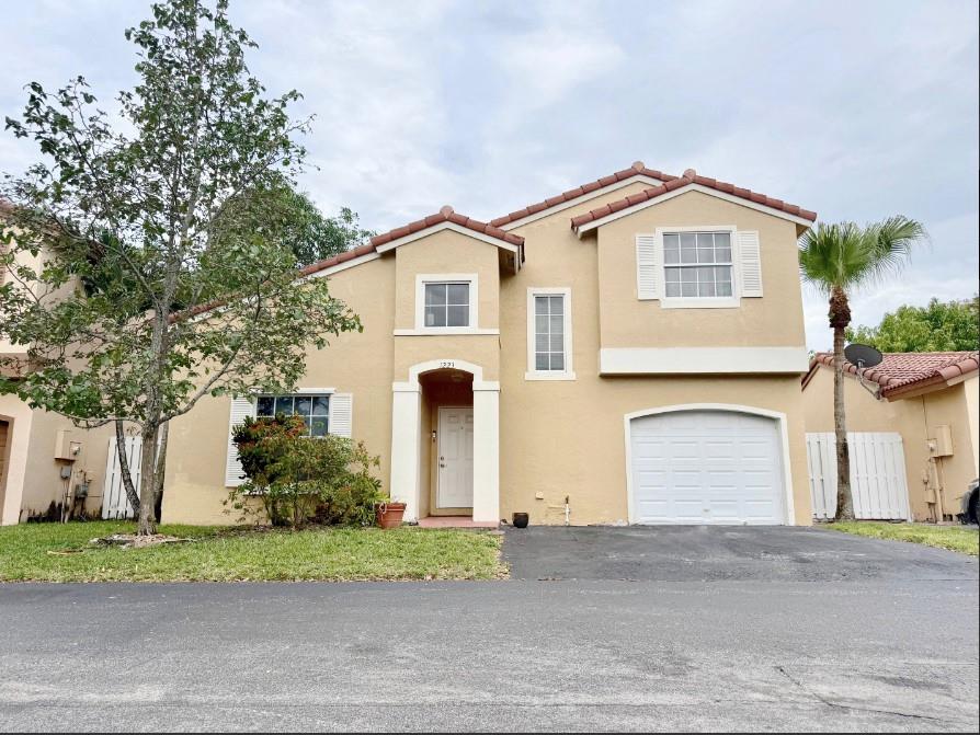 This updated spacious 3-bedroom, 2.5-bathroom home has a newer roof installed in 2018, upgraded electrical system, and a new panel as of 2024. Inside, enjoy slate tile flooring and soaring vaulted ceilings that enhance the airy open-concept layout. The kitchen has ample cabinetry and storage space, stainless steel appliance a bar for casual dining, and sliding door to the privacy fenced yard and patio with mango and papaya trees. The main-level owner’s suite offers a luxurious retreat with a walk-in closet and an en suite bath complete with a double-sink vanity and step-in shower. Enjoy a low HOA, community pool, and close proximity to local shopping and dining venues. Lowest priced home in the community, act fast!