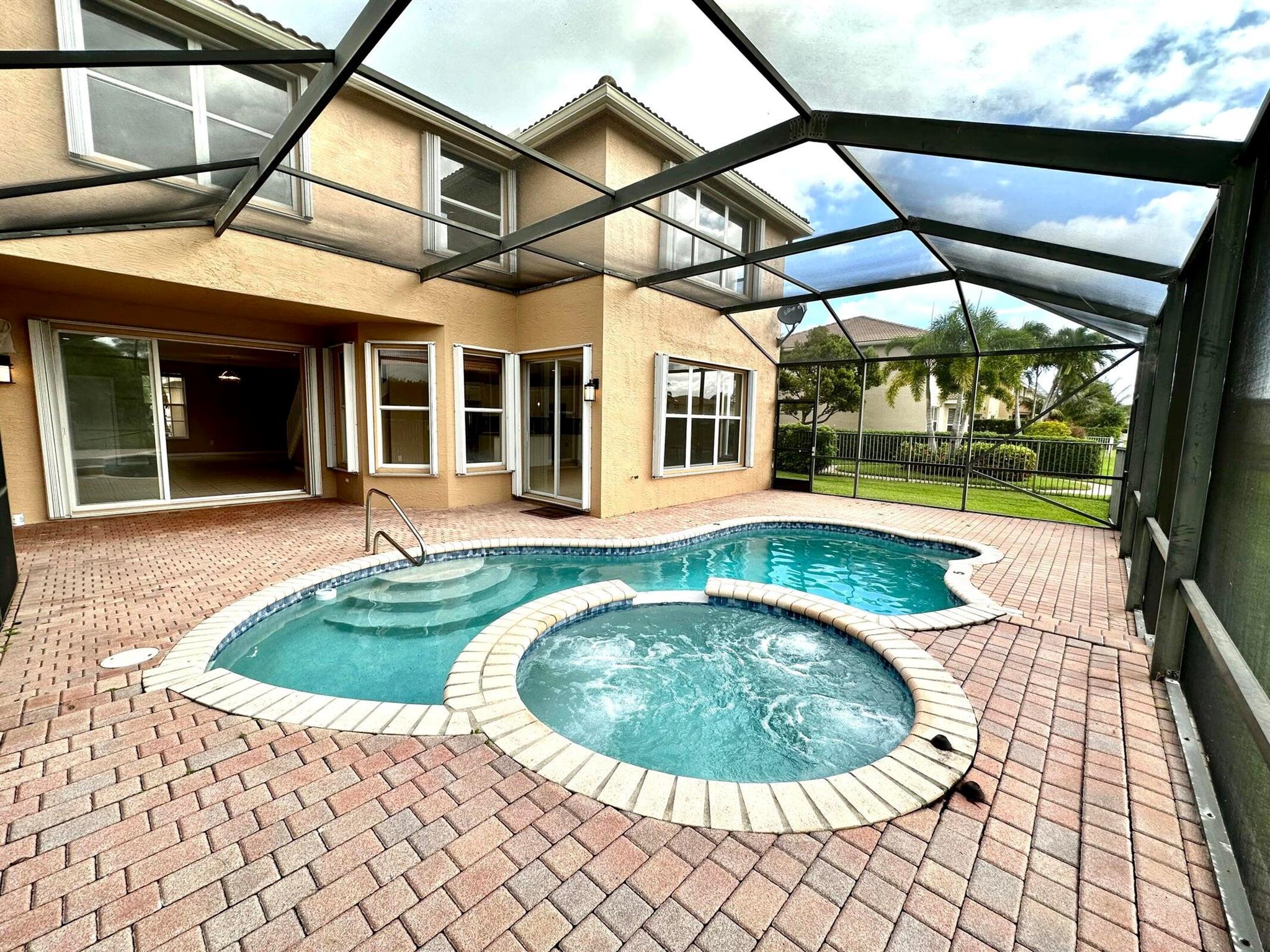 Stunning Waterfront 6-Bedroom 4-Bathroom Pool Home on Lake, with 3-Car Garage! Luxuriously Renovated bathrooms and kitchen. Enjoy the Florida lifestyle with a private screened-in pool and spa overlooking the water.The home features a large open-concept kitchen with wood cabinetry, granite countertops, and upgraded faucets, seamlessly flowing into the family room--perfect for entertaining. A full bedroom and bathroom are conveniently located on the main floor, ideal for guests or a home office.Additional highlights include a whole-house water filtration system and access to resort-style community amenities, including a gym, tennis courts, soccer field, and basketball cour