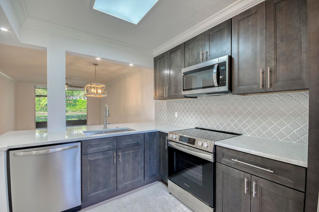 Photo of 6865 Huntington Lane #105, Delray Beach, FL 33446 (MLS # R11135710)