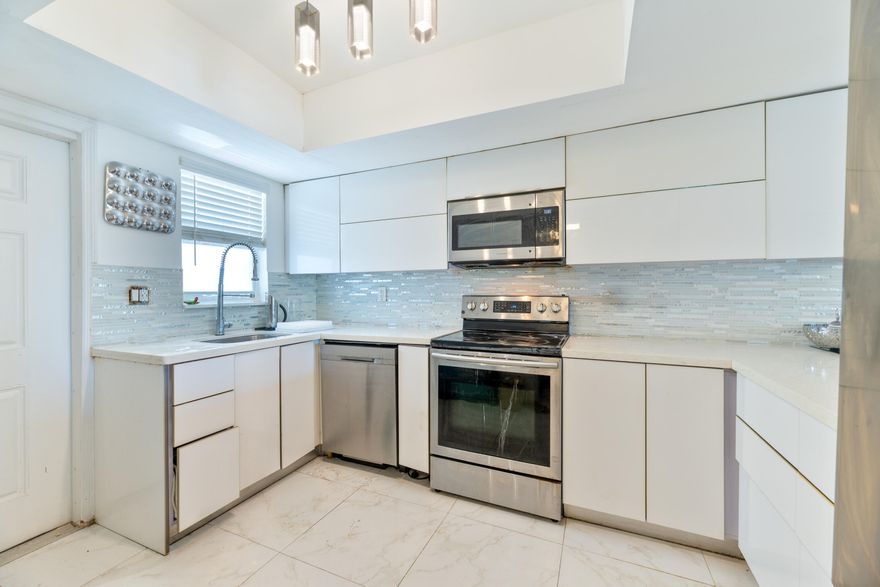 An exceptional opportunity to own one of the lowest-priced waterfront condos with dockage in East Fort Lauderdale, this updated residence combines comfort, functionality, and an unbeatable coastal lifestyle. As you step inside there is an abundant natural light, creating a bright and inviting atmosphere throughout. The spacious living area flows seamlessly into a screened-in 24x6 patio, where you can relax and enjoy tranquil canal views—perfect for morning coffee or evening unwinding. The updated kitchen is designed for both everyday living and entertaining, featuring stainless steel appliances, a stone counter, and modern LED lighting. Both bathrooms have been updated with beautiful porcelain tile and modern finishes!  The generously sized primary suite includes an ensuite bathroom for added privacy, while the second bedroom and full bath provide flexibility for guests, a home office, or seasonal living. This unit also offers an impressive amount of closet space, along with an opportunity to install an in-unit washer and dryer. Boating enthusiasts will appreciate the availability of dockage for vessels up to 32 feet, with water and electric service, and no fixed bridges—offering direct ocean access just moments from the Intracoastal Waterway. Dock slips are available through the association at a very reasonable rate. Residents enjoy a well-maintained building with secure access and a variety of amenities, including a waterfront pool, BBQ area, elevator, laundry facilities, and additional storage conveniently located near the unit. The building has completed its 40-year inspection. Ideally located just minutes from Fort Lauderdale's pristine beaches, fine dining, shopping, and entertainment, this condo offers both convenience and lifestyle. Pet-friendly for cats only, with annual leasing permitted. Whether you're looking for a primary residence, seasonal retreat, or investment opportunity, this is a rare chance to secure a waterfront property in one of Fort Lauderdale's most sought-after communities