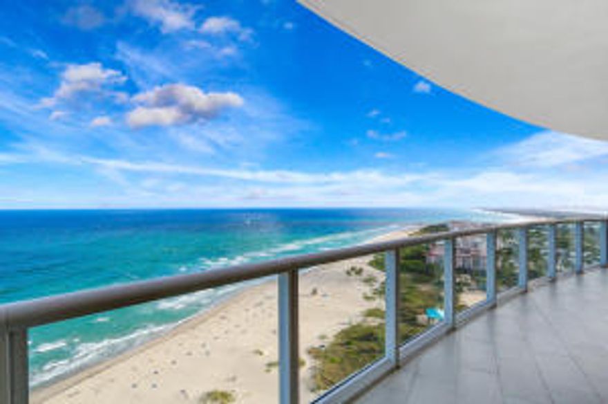 Ritz Lifestyle & Ultimate Luxury Living!Beautifully furnished Oceanfront residence w/3BR + Office, 3.5BA,Coveted 2 Car Garage, Impact Glass, 3950SF. Professionally decorated w/highest quality finishes & furnishings by Interiors by Steve G. Panoramic direct ocean & Intracoastal views from every room. Private elevator, marble floors, decorative ceilings w/crown accents, split floor plan, ensuite baths. Formal Living & Dining w/direct ocean views, granite wet bar w/wine cooler, media/family room. Chef's kitchen w/granite island, Wolf 6 Burner Gas Range & Wall Ovens, SubZero Refrigerator, Miele Cappuccino. Oceanfront master suite, marble master bath w/jacuzzi & bidet. 24 HR concierge, 8.8 acres w/375' pristine beachfront, infinity & lap pools, state-of-the-art fitness center, valet, theatre, Beachside grilling station,business center and meeting room, social room, on site restaurant and also equipped with natural gas and diesel generators.  Unit comes with additional storage cage, 2 additional parking spaces. Condo Living at its BEST!  A Must See!
