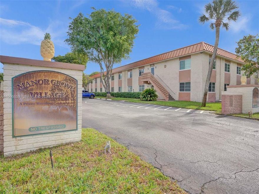 Tucked within Manor Grove Village Four, this  2BR/2BA residence offers approximately 1,200 sq. ft. of comfortable living space with serene tropical garden views. Both bathrooms updated, impact windows.  Relax on your private balcony overlooking the lush courtyard and enjoy the peaceful atmosphere just moments from the energy of Wilton Drive.  Community amenities include a riverfront pool, tennis courts, and sauna, all in a prime location near Richardson Historic Park and just a short walk to Wilton Drive dining, shopping, and nightlife.