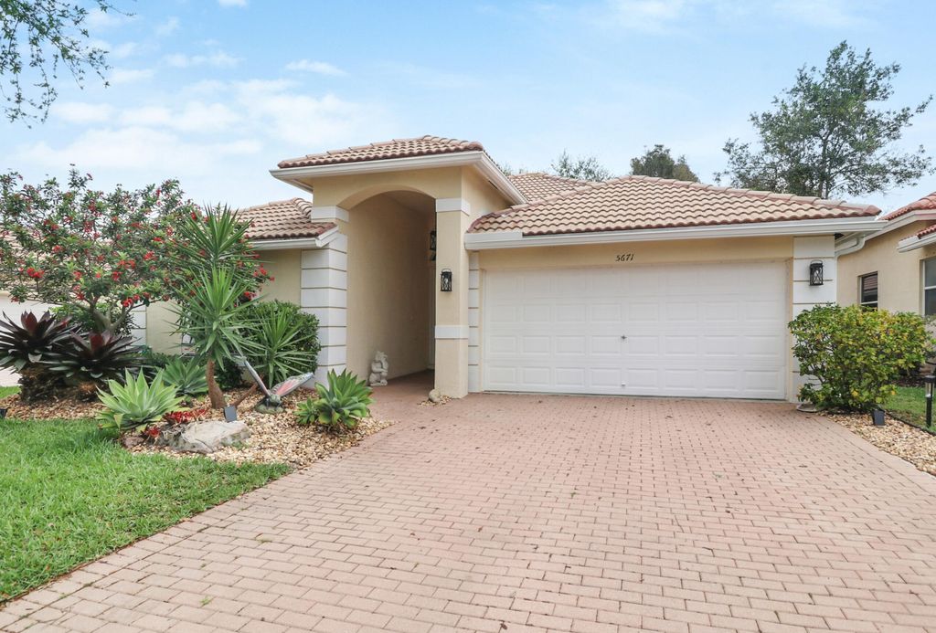 Photo of 5671 S Fountains Drive S, Lake Worth, FL 33467 (MLS # B26004139)