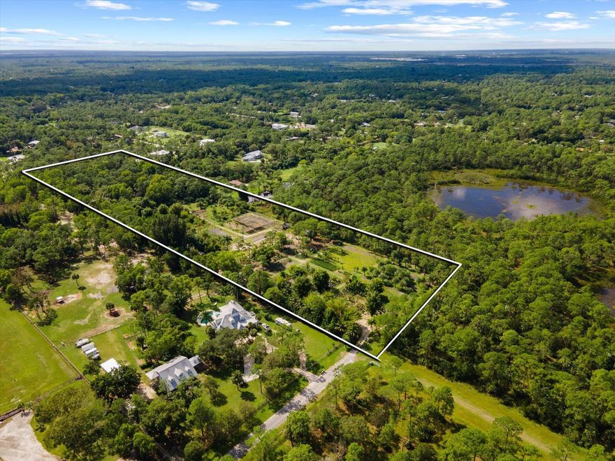 Spectacular to be constructed home on the best 10 acre lot in the ranch estates of Rocky Pines, Jupiter. One of the best 10 acre lots anywhere in Palm Beach County! Enjoy unparalleled PRIVACY, SECLUSION and TRANQUILITY amidst a beautiful mature tropical landscape at the end of a paved dead-end road, backing up to a preserve to the West and a canal to the South. Photos of the home are of an almost identical house already built on a different property. This home can be viewed by appointment only. Spectacular New Construction to be built by Langer Construction. This spacious custom style coastal single-story home is 4,225 Ac sf, with 4 bedrooms, 4 baths, 2 half baths, office & bonus room, oversized 3 car garage. Additional buildings and pool may be constructed (for additional cost)