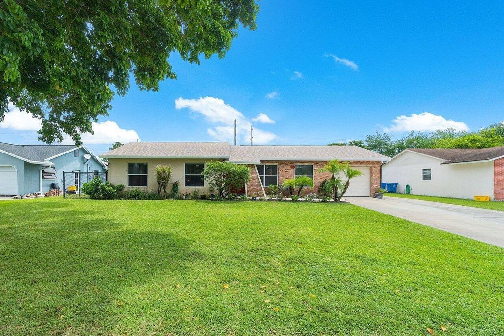 Photo of 278 Sandpiper Avenue, Royal Palm Beach, FL 33411 (MLS # R10912114)