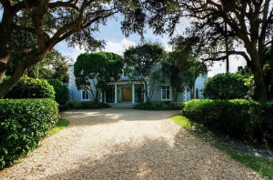 Tradition and elegance best describe this pristine beachside estate. Listen to the waves from one of several verandas and loggias overlooking the .66 acres of exquisite gardens, lawns and 50 ft pool. This 2 story residence has more than 6500 total square feet and is situated on a private cul de sac. The main floor features a magnificent entryway with sweeping staircase and opens