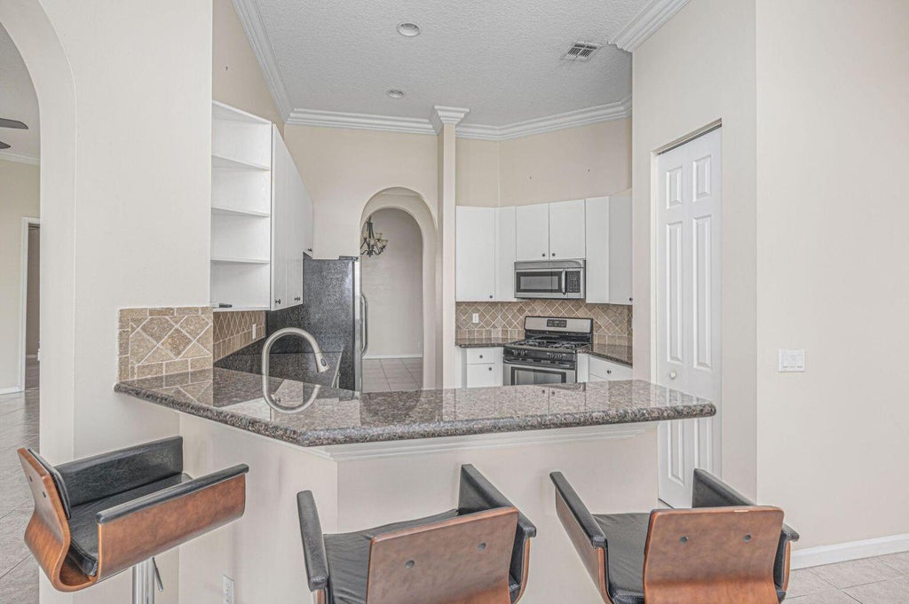 Photo of 137 NW Magnolia Lakes Boulevard, Port Saint Lucie, FL 34986 (MLS # B26021177)