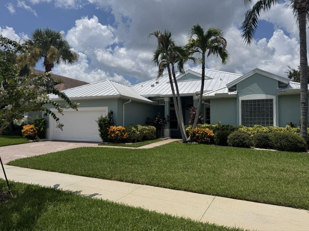 Photo of 137 NW Magnolia Lakes Boulevard, Port Saint Lucie, FL 34986 (MLS # B26021177)