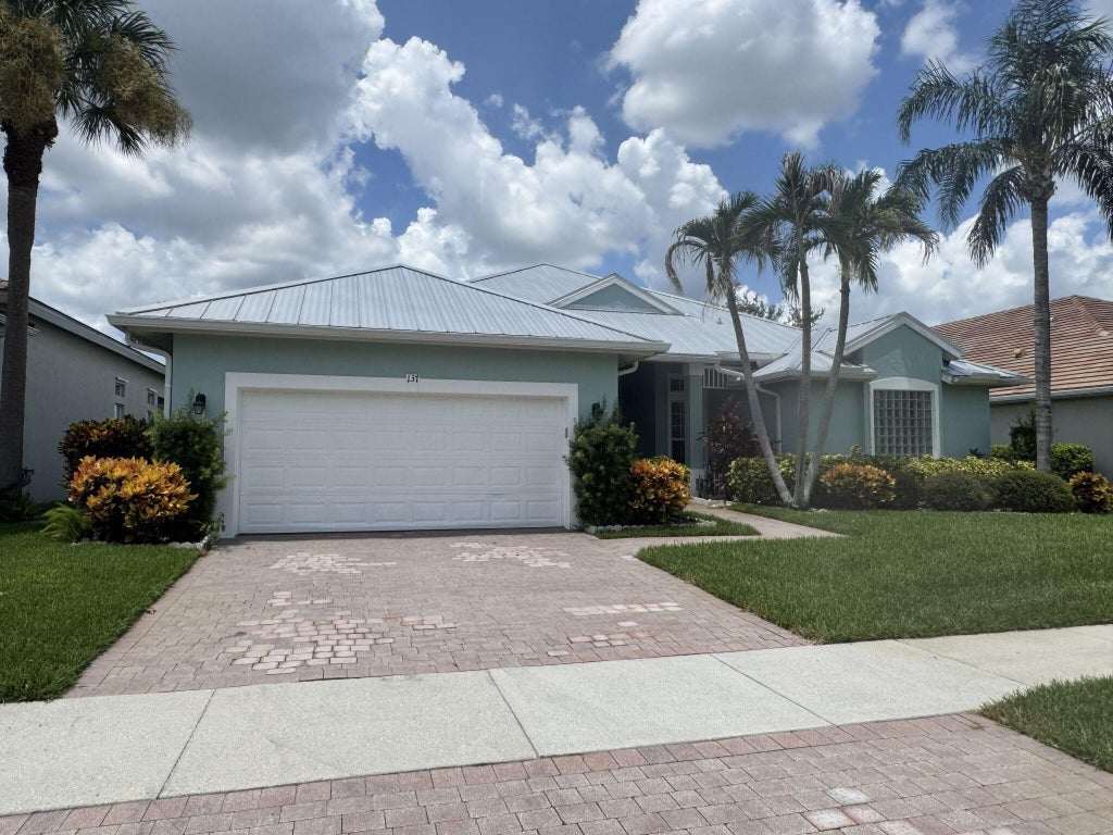 Photo of 137 NW Magnolia Lakes Boulevard, Port Saint Lucie, FL 34986 (MLS # B26021177)