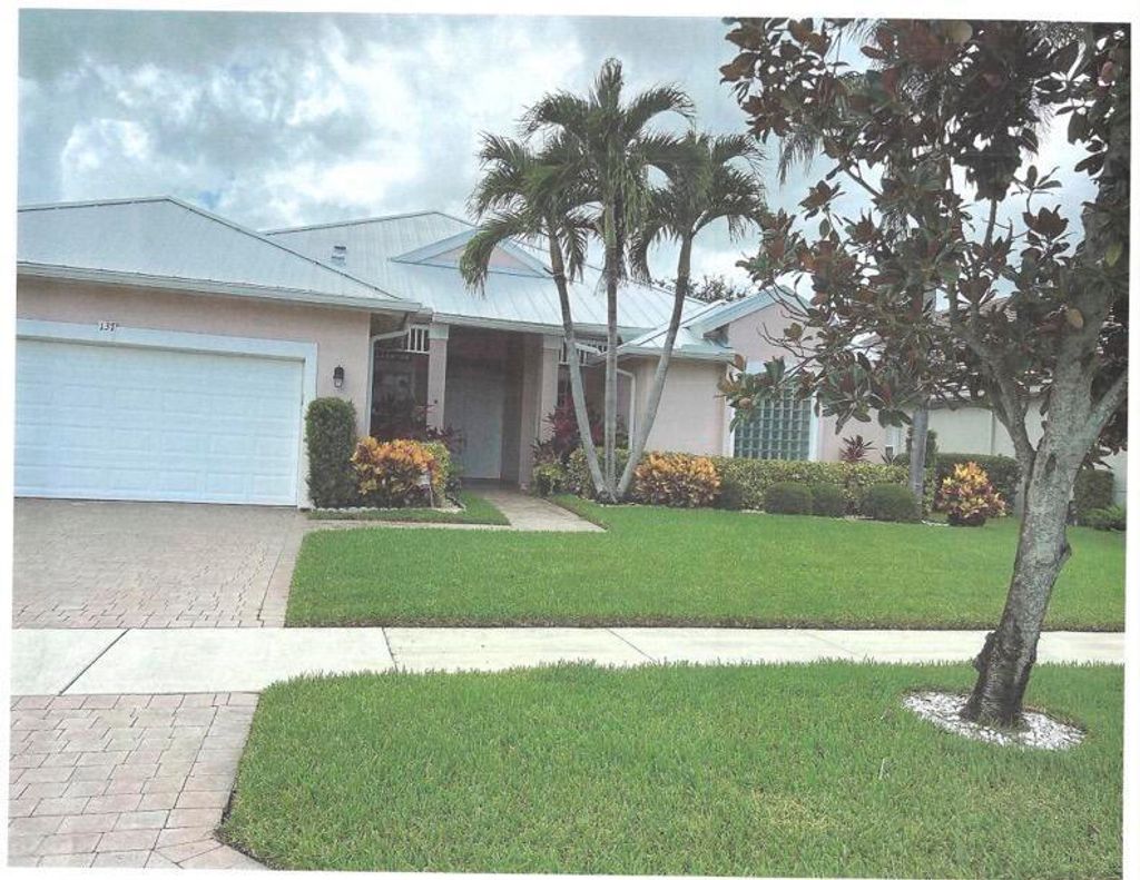 Photo of 137 NW Magnolia Lakes Boulevard, Port Saint Lucie, FL 34986 (MLS # B26021177)